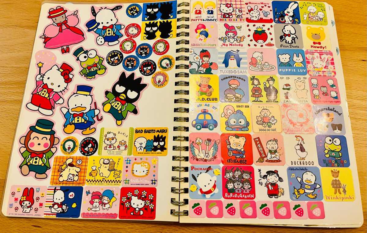 Vintage-style Japanese sticker album with arranged sheets / 昔風の日本のシール帳に整然と並べられたシート（縦）