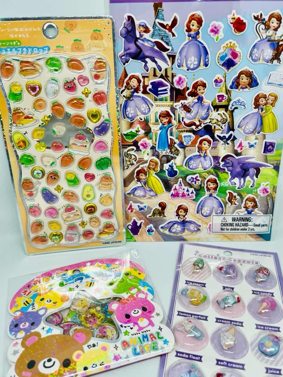 Flat lay of kawaii Japanese 3D stickers and albums / 日本のかわいい3Dシールとシール帳のフラットレイ写真
